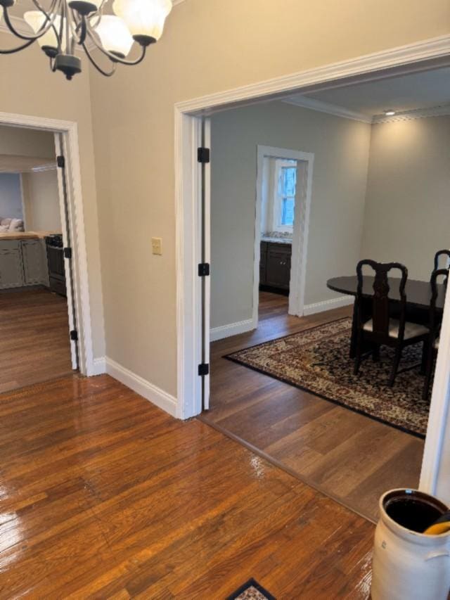 500 Brown St, Celina, TN 38551 - dining space featuring a chandelier, ornamental molding, baseboards, and wood finished floors