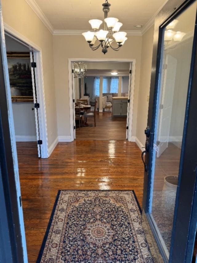 500 Brown St, Celina, TN 38551 - hallway with a chandelier, crown molding, wood finished floors, and baseboards