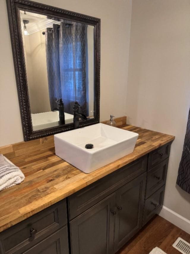 500 Brown St, Celina, TN 38551 - bathroom featuring wood finished floors, vanity, and baseboards