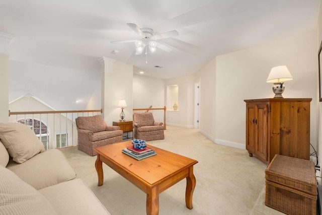 living room with baseboards, a ceiling fan, and light colored carpet