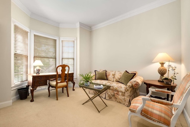 sitting room featuring baseboards, ornamental molding, and carpet