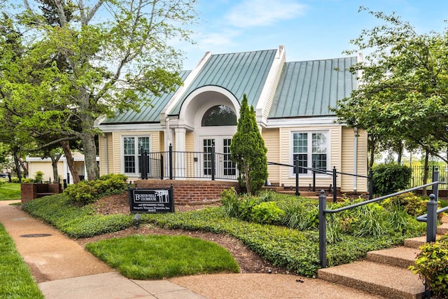 view of front of house featuring a standing seam roof and metal roof