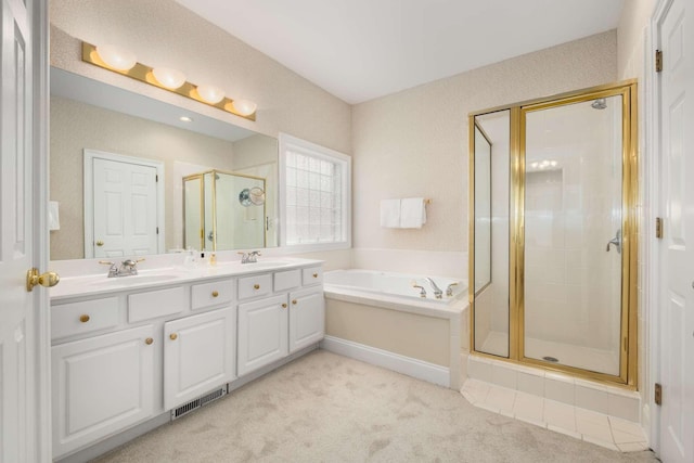 bathroom with a sink, a shower stall, a garden tub, and visible vents