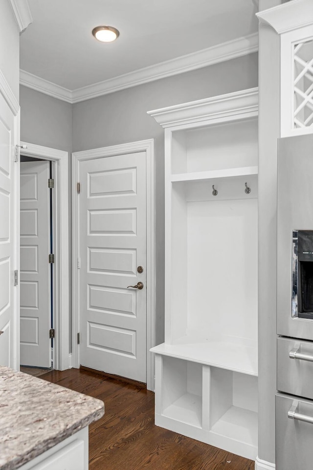 mudroom with ornamental molding and dark wood-type flooring