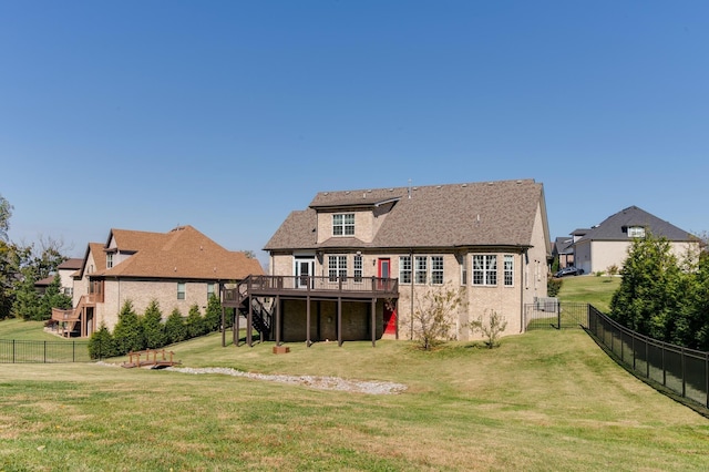 back of property with stairs, a fenced backyard, a lawn, and a wooden deck