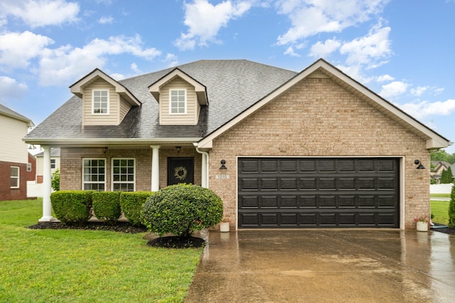 view of front of home with a front lawn, brick siding, a shingled roof, concrete driveway, and an attached garage