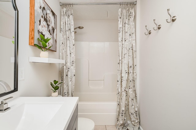 full bathroom featuring vanity, tile patterned floors, shower / bath combo with shower curtain, and toilet
