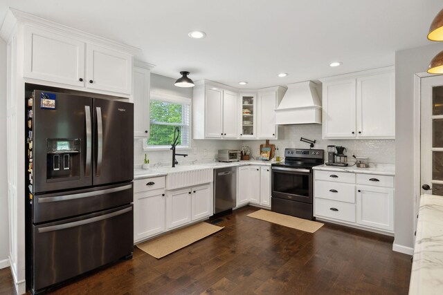 790 Noah Dr, Hohenwald, TN 38462 - kitchen featuring a sink, decorative backsplash, white cabinets, custom range hood, and appliances with stainless steel finishes