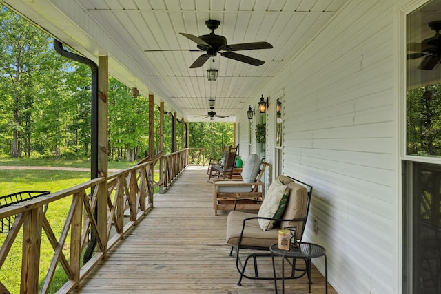 790 Noah Dr, Hohenwald, TN 38462 - wooden terrace featuring covered porch, a ceiling fan, and a yard