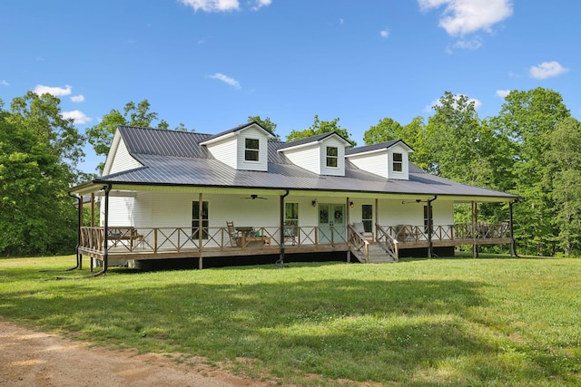 790 Noah Dr, Hohenwald, TN 38462 - farmhouse with a front yard, covered porch, and metal roof