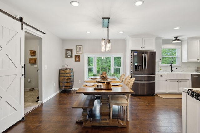 790 Noah Dr, Hohenwald, TN 38462 - dining space featuring recessed lighting, a barn door, and dark wood-style floors