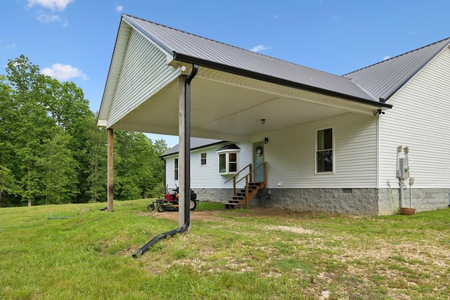 790 Noah Dr, Hohenwald, TN 38462 - exterior space featuring a yard, entry steps, an attached carport, and metal roof