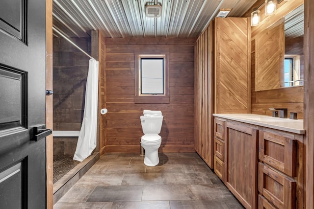 bathroom with wood walls, plenty of natural light, and toilet