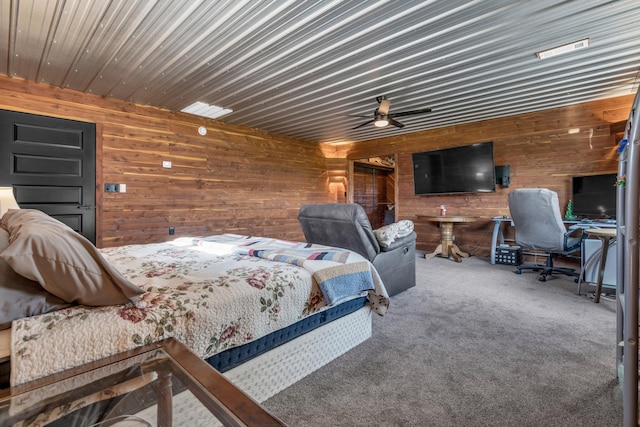bedroom featuring carpet flooring and wooden walls