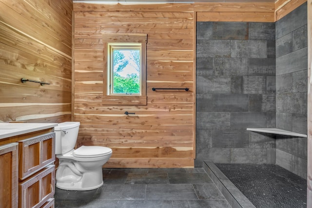 full bathroom featuring a walk in shower, toilet, wood walls, and vanity