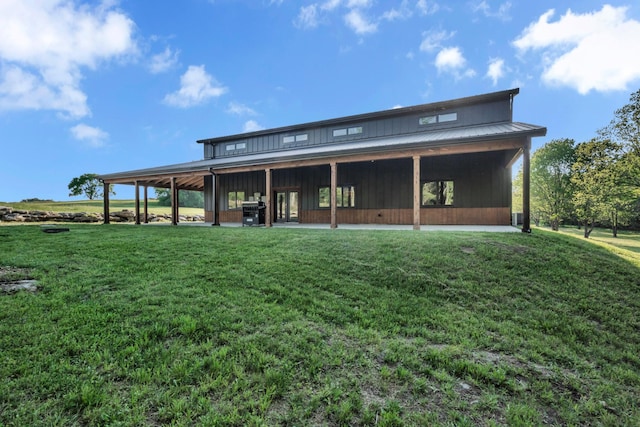 exterior space with a lawn and metal roof