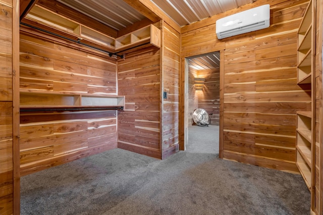 walk in closet featuring carpet and a wall unit AC