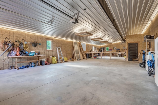 garage featuring a workshop area and a garage door opener