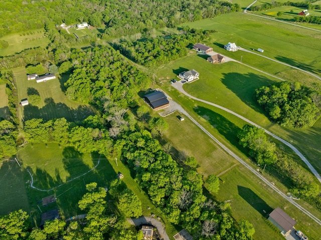 birds eye view of property with a rural view