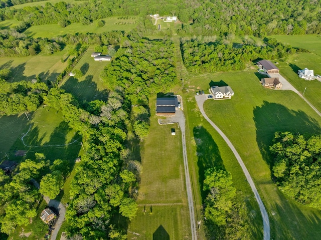 birds eye view of property with a rural view