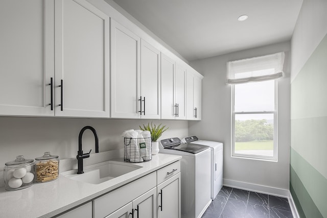 717 41st Ave N, Nashville, TN 37209 - laundry area featuring cabinet space, independent washer and dryer, baseboards, dark marble finish flooring, and recessed lighting