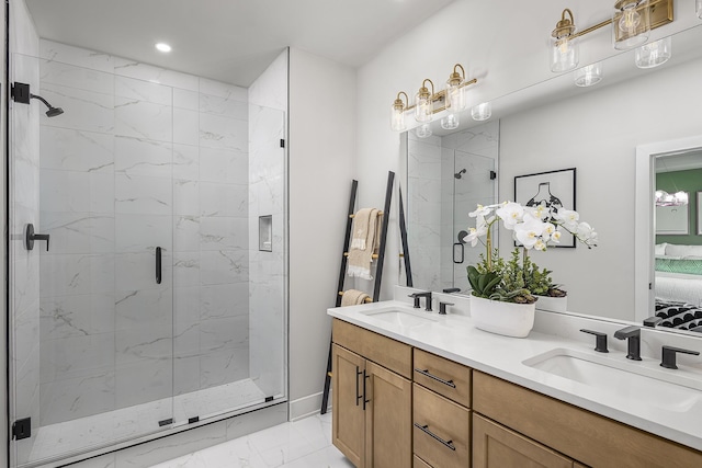 717 41st Ave N, Nashville, TN 37209 - ensuite bathroom with marble look tiles, a shower stall, recessed lighting, and double vanity