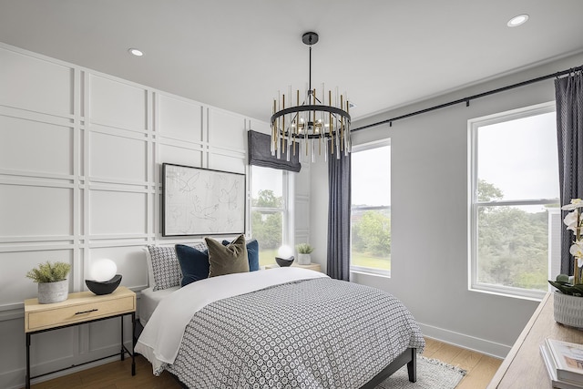 717 41st Ave N, Nashville, TN 37209 - bedroom featuring a chandelier, wood finished floors, baseboards, and recessed lighting