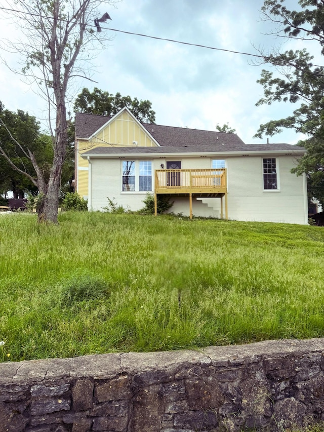 back of house featuring a deck