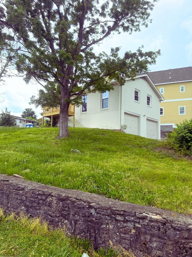 view of home's exterior with an attached garage and stucco siding
