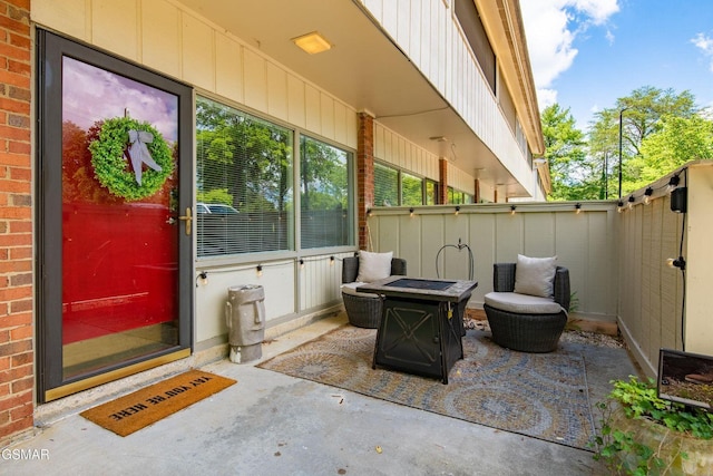 view of patio / terrace featuring fence and an outdoor fire pit