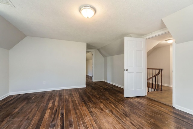 584 Lancaster Hwy, Hickman, TN 38567 - bonus room featuring baseboards, vaulted ceiling, dark wood-type flooring, and visible vents