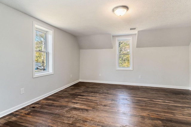 584 Lancaster Hwy, Hickman, TN 38567 - additional living space featuring visible vents, dark wood-type flooring, and a healthy amount of sunlight