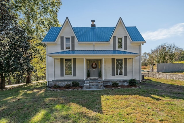 584 Lancaster Hwy, Hickman, TN 38567 - view of front of property with covered porch, a chimney, metal roof, and a front yard