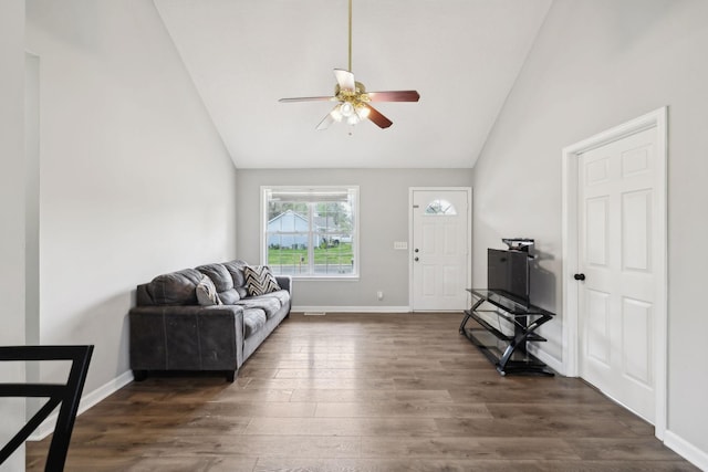living area featuring baseboards, a ceiling fan, high vaulted ceiling, and dark wood-type flooring