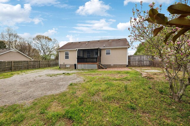 117 Sloan Dr, Springfield, TN 37172 - back of house featuring a lawn, crawl space, a fenced backyard, and a sunroom