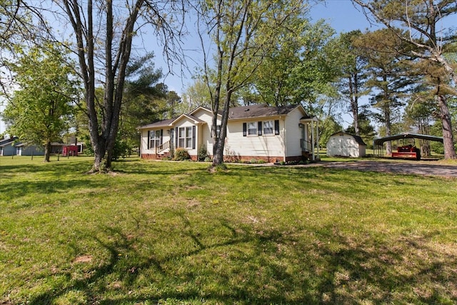 1712 Franklin Pike, Lewisburg, TN 37091 - ranch-style house featuring a front lawn, an outdoor structure, a detached carport, and a storage unit