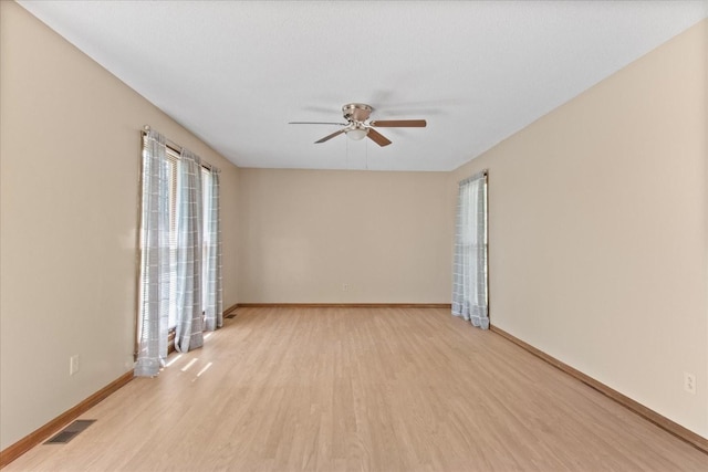 1712 Franklin Pike, Lewisburg, TN 37091 - spare room featuring visible vents, light wood-style floors, ceiling fan, and baseboards