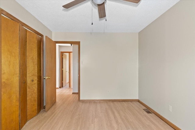 1712 Franklin Pike, Lewisburg, TN 37091 - unfurnished bedroom with visible vents, a textured ceiling, light wood-style flooring, and baseboards