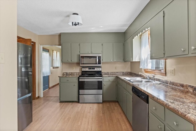1712 Franklin Pike, Lewisburg, TN 37091 - kitchen with light wood-style floors, a sink, appliances with stainless steel finishes, and a healthy amount of sunlight