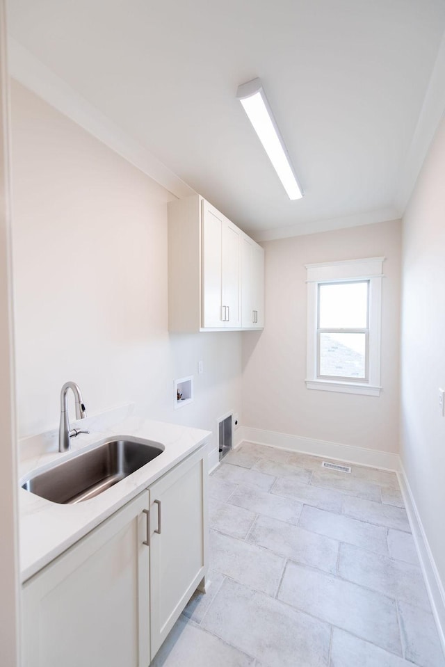 laundry room with visible vents, hookup for a washing machine, a sink, cabinet space, and hookup for an electric dryer