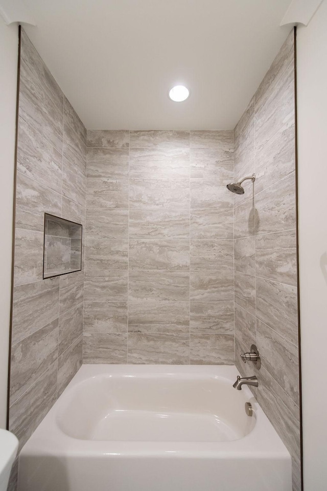 bathroom with recessed lighting and shower / bathtub combination