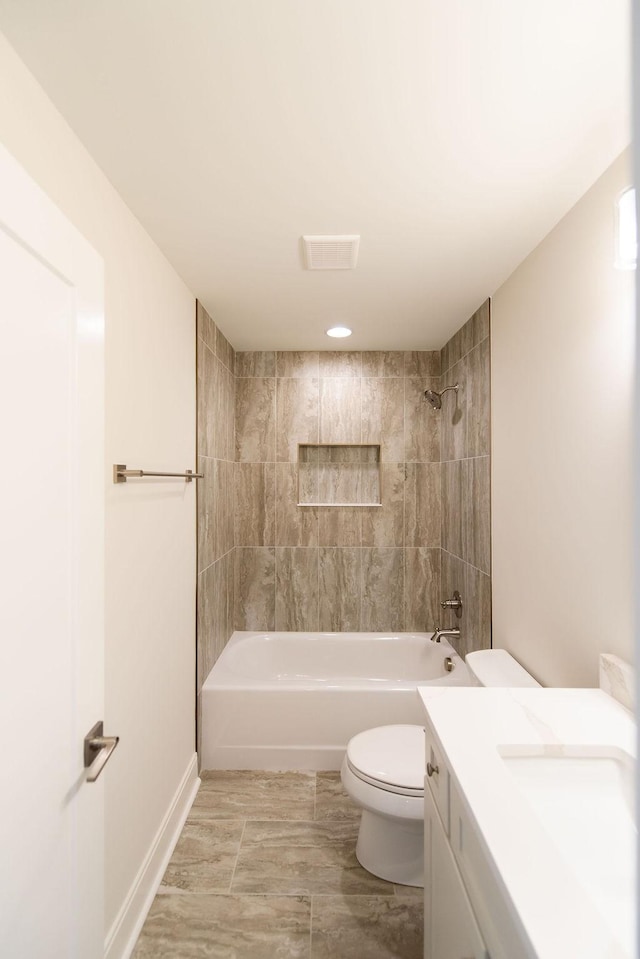 bathroom featuring shower / bathtub combination, vanity, and toilet