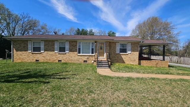 ranch-style house featuring brick siding, crawl space, and a front yard