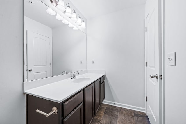 bathroom with vanity and baseboards