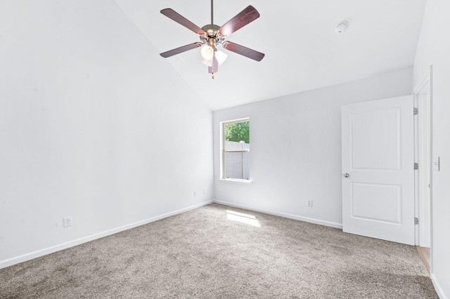 empty room with baseboards, carpet flooring, ceiling fan, and lofted ceiling