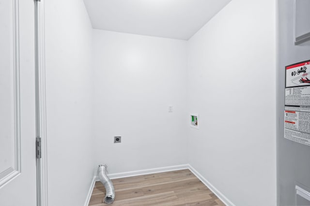 washroom with washer hookup, laundry area, light wood-style flooring, baseboards, and hookup for an electric dryer