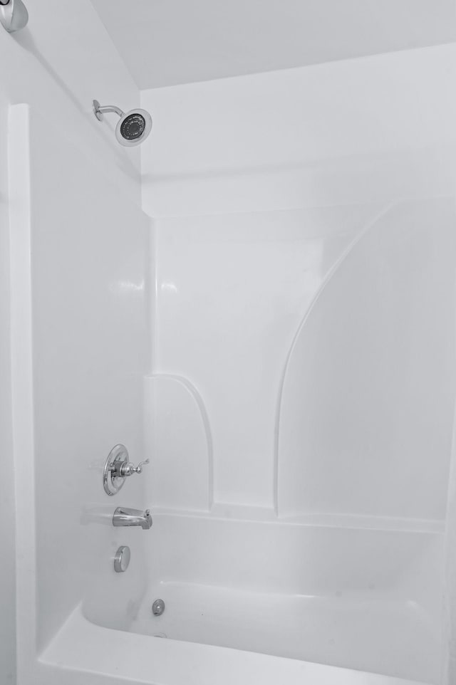 bathroom featuring washtub / shower combination