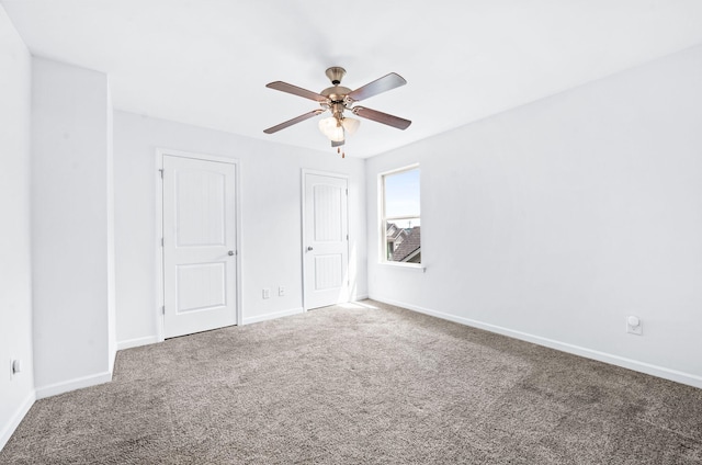 unfurnished bedroom with carpet floors and baseboards