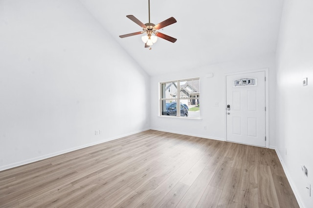 unfurnished living room with a ceiling fan, high vaulted ceiling, baseboards, and light wood finished floors