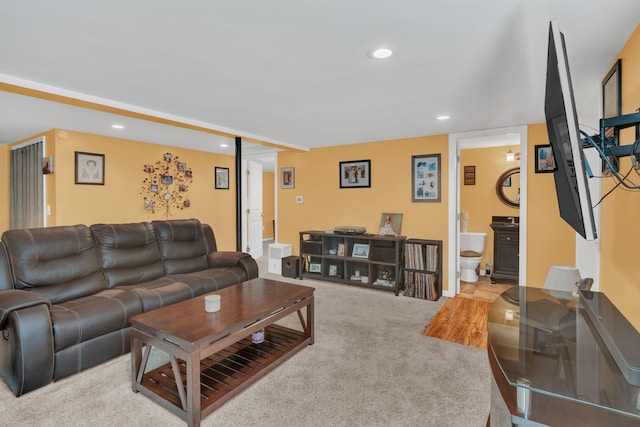 carpeted living room featuring recessed lighting